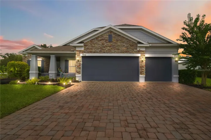 Twilight front exterior with welcoming curb appeal.