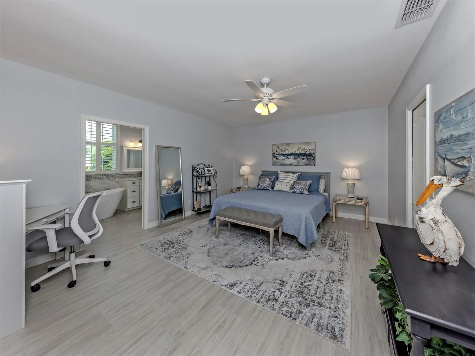The primary suite is located on the back of the home and so spacious