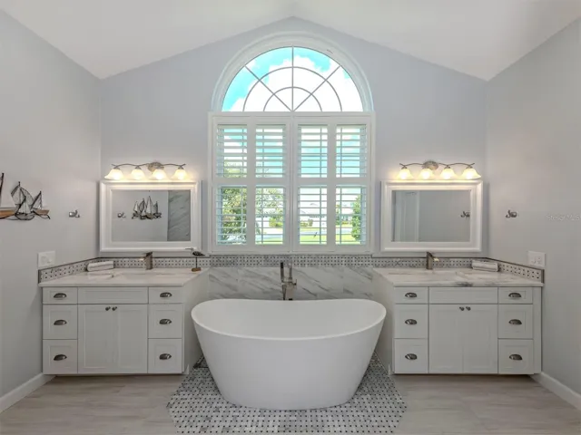 This spa like bathroom makes getting ready for a night out for two a breeze