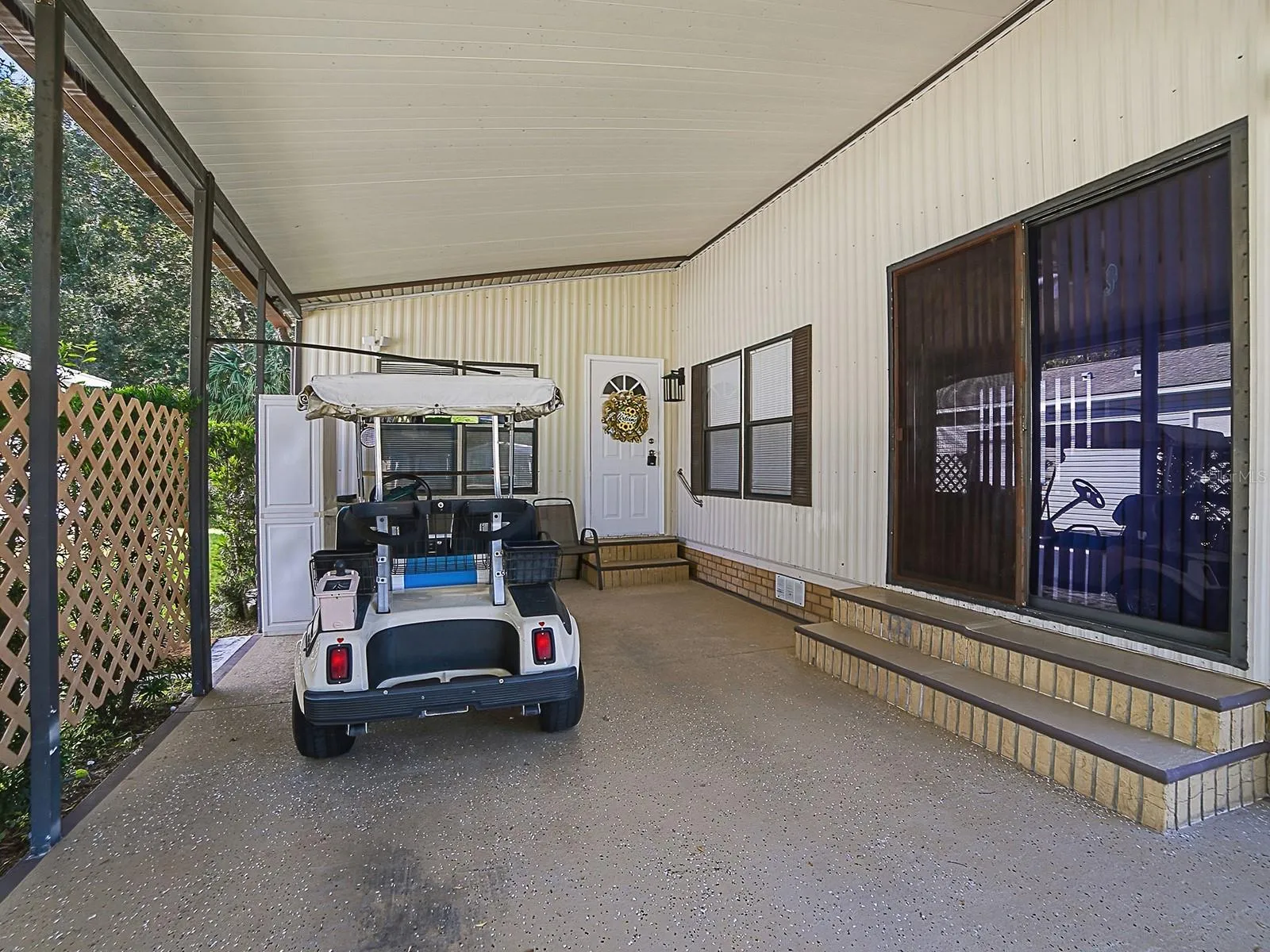 Carport includes golfcart