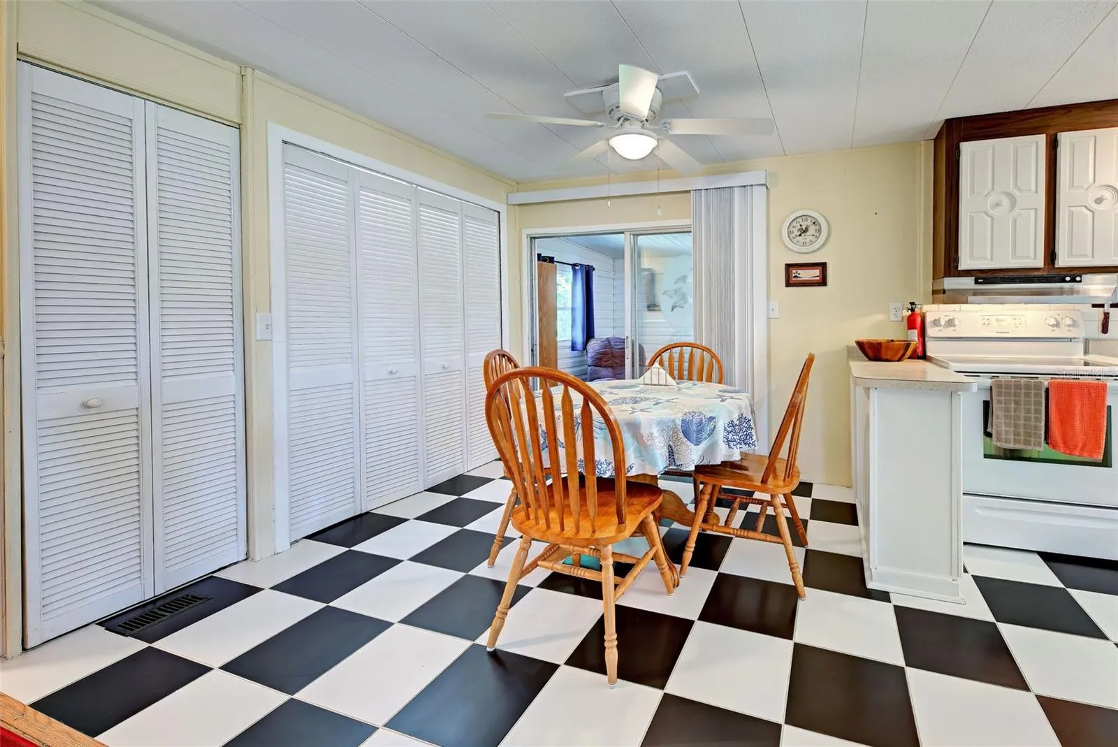 Dining area off kitchen (storage closet and laundry closet to left), sliders lead to Florida Room