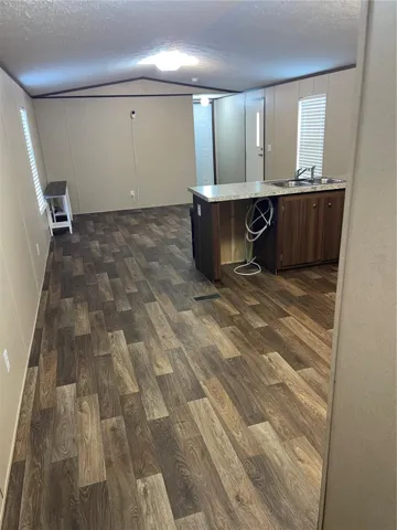 Back door view into kitchen and living room