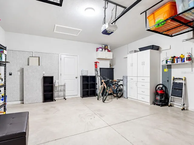 Garage with Overhead Storage and Cabinets