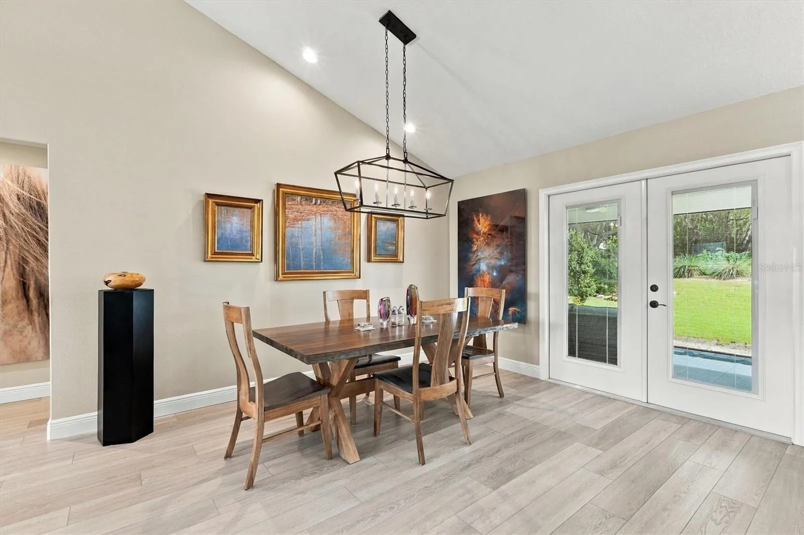 LOVELY DINING AREA WITH ENTRANCE TO SCREENED PATIO