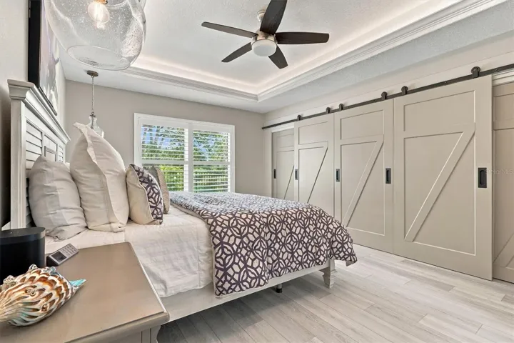 PRIMARY BEDROOM WITH CUSTOM DOORS