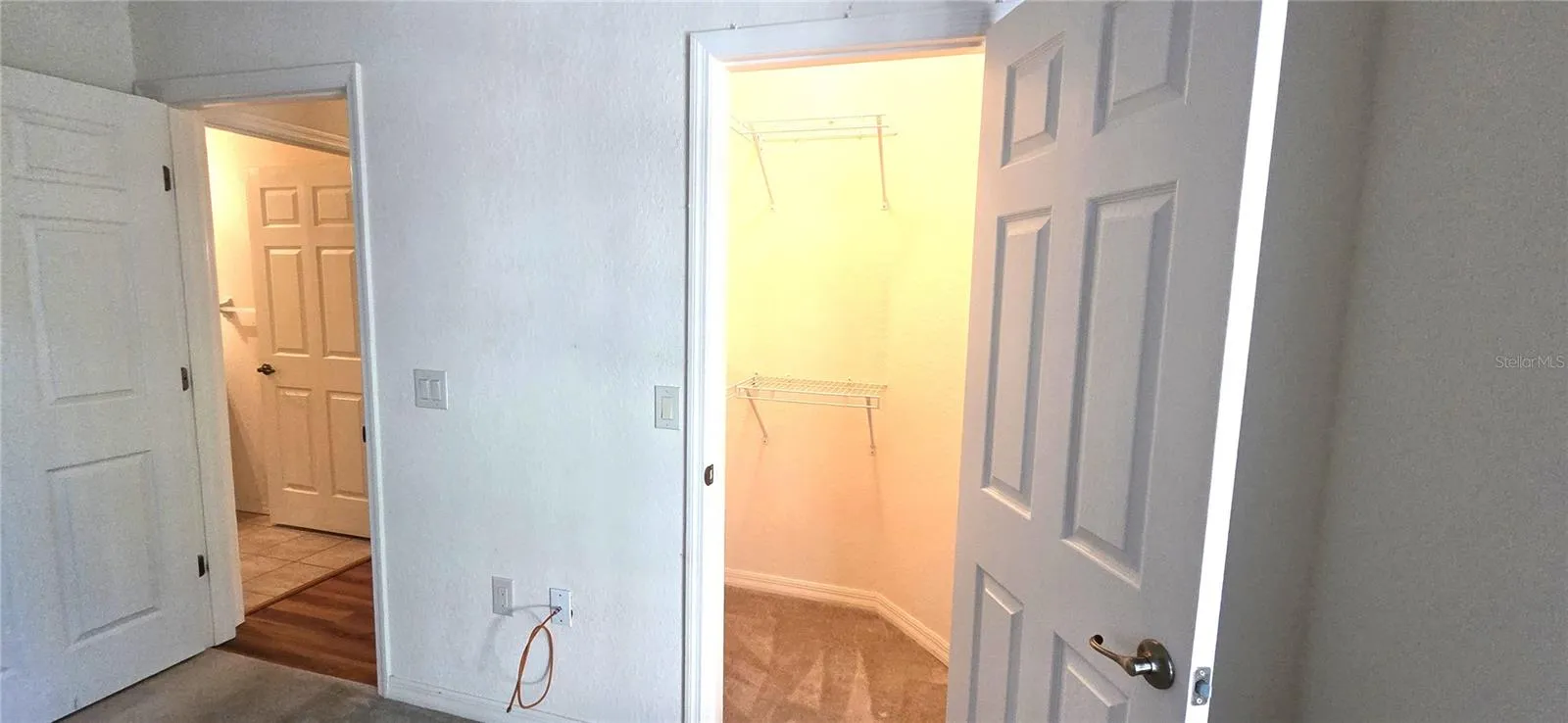 Bedroom 2 Walk-in Closet on right/Bathroom 2 doorway on left