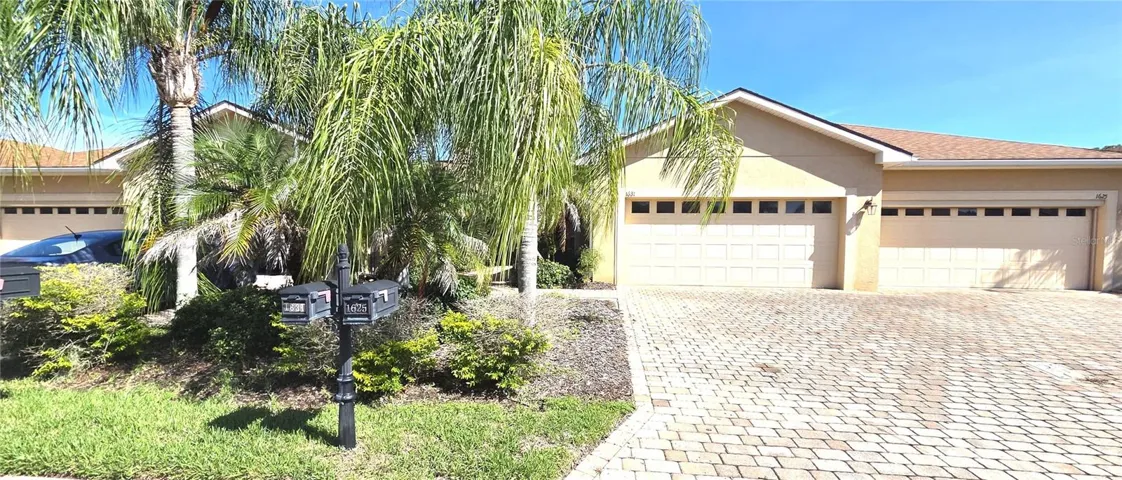 Paver Driveway with 2 Car Attached Garage