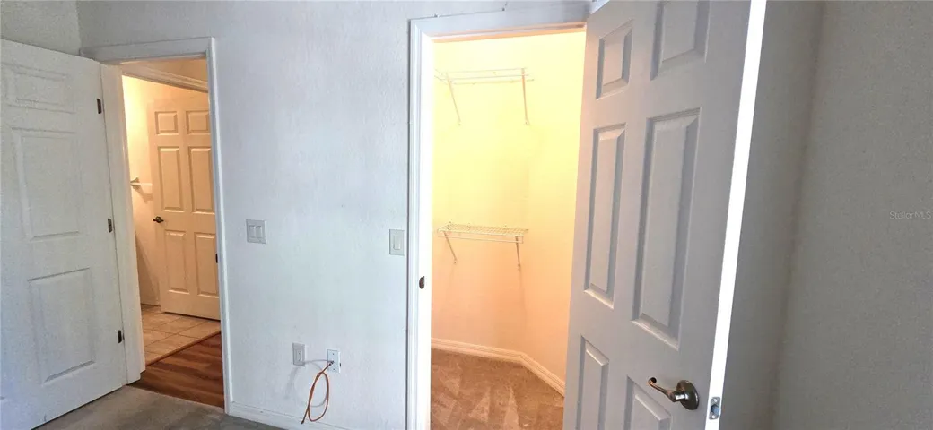 Bedroom 2 Walk-in Closet on right/Bathroom 2 doorway on left