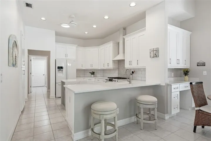 Breakfast bar and adjacent dry bar and optional desk space.