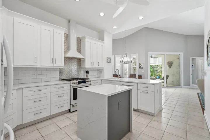 Absolute showstopper kitchen with electric-enhanced island, vented range hood, amazing cabinet and pantry space.