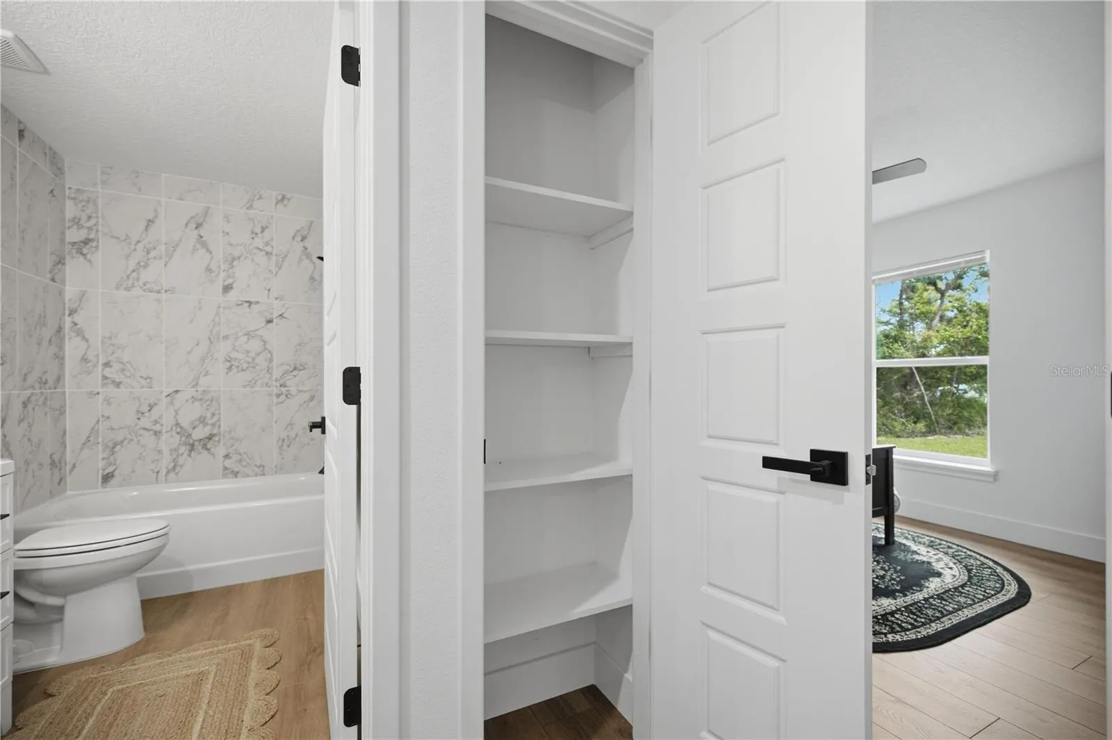 Hall closets with solid wood built-in shelving