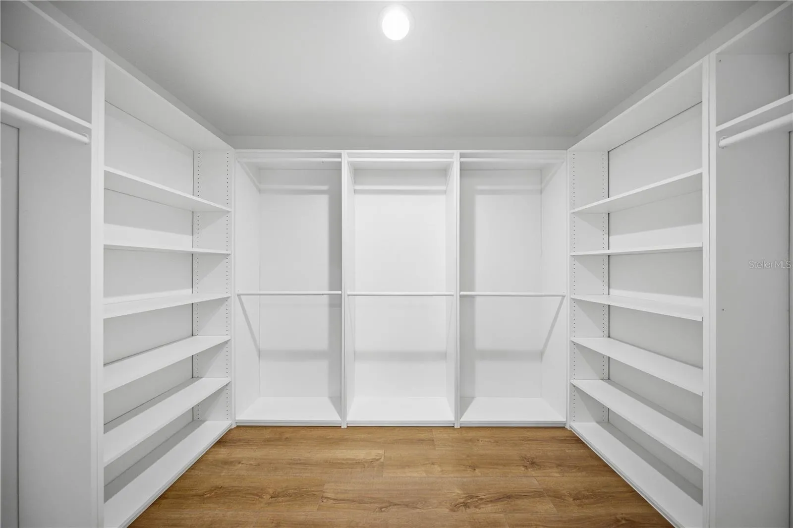 XL walk in closet with built-in organization