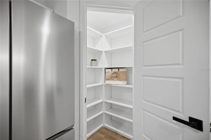 Walk-in pantry with built-in shelving