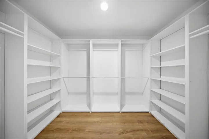 XL walk in closet with built-in organization