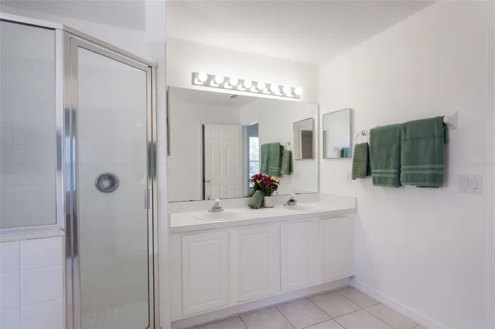 En suite bath -- private water closet is out of view
