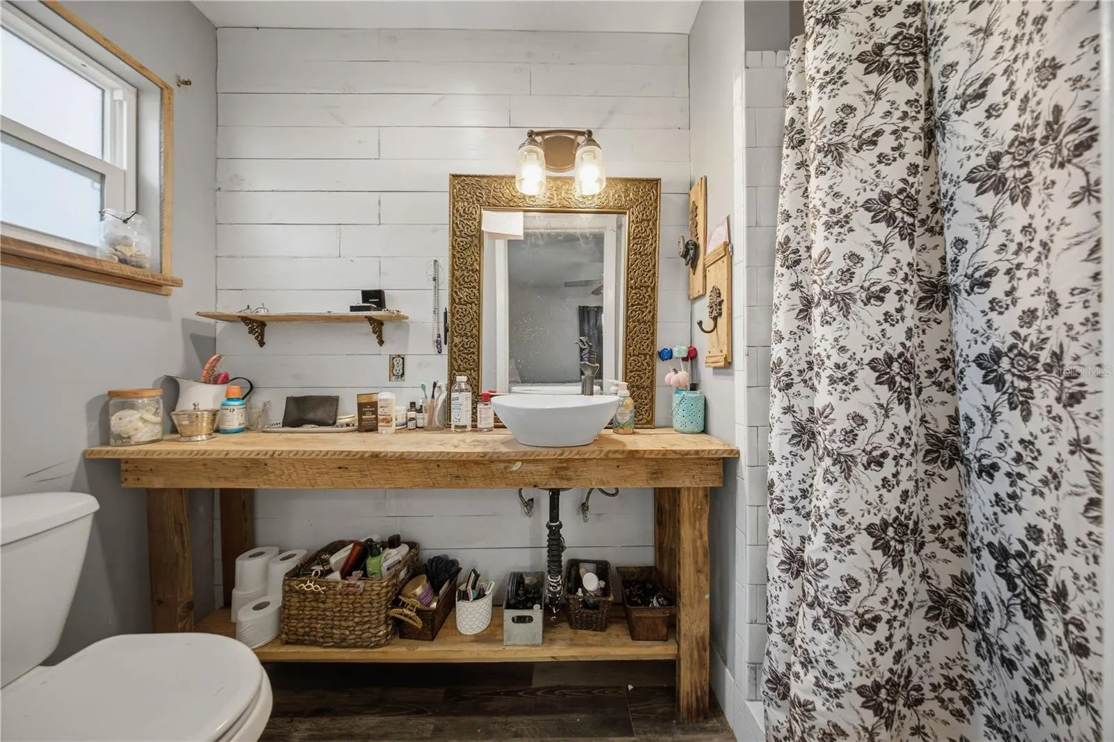Primary bathroom with custom wood vanity