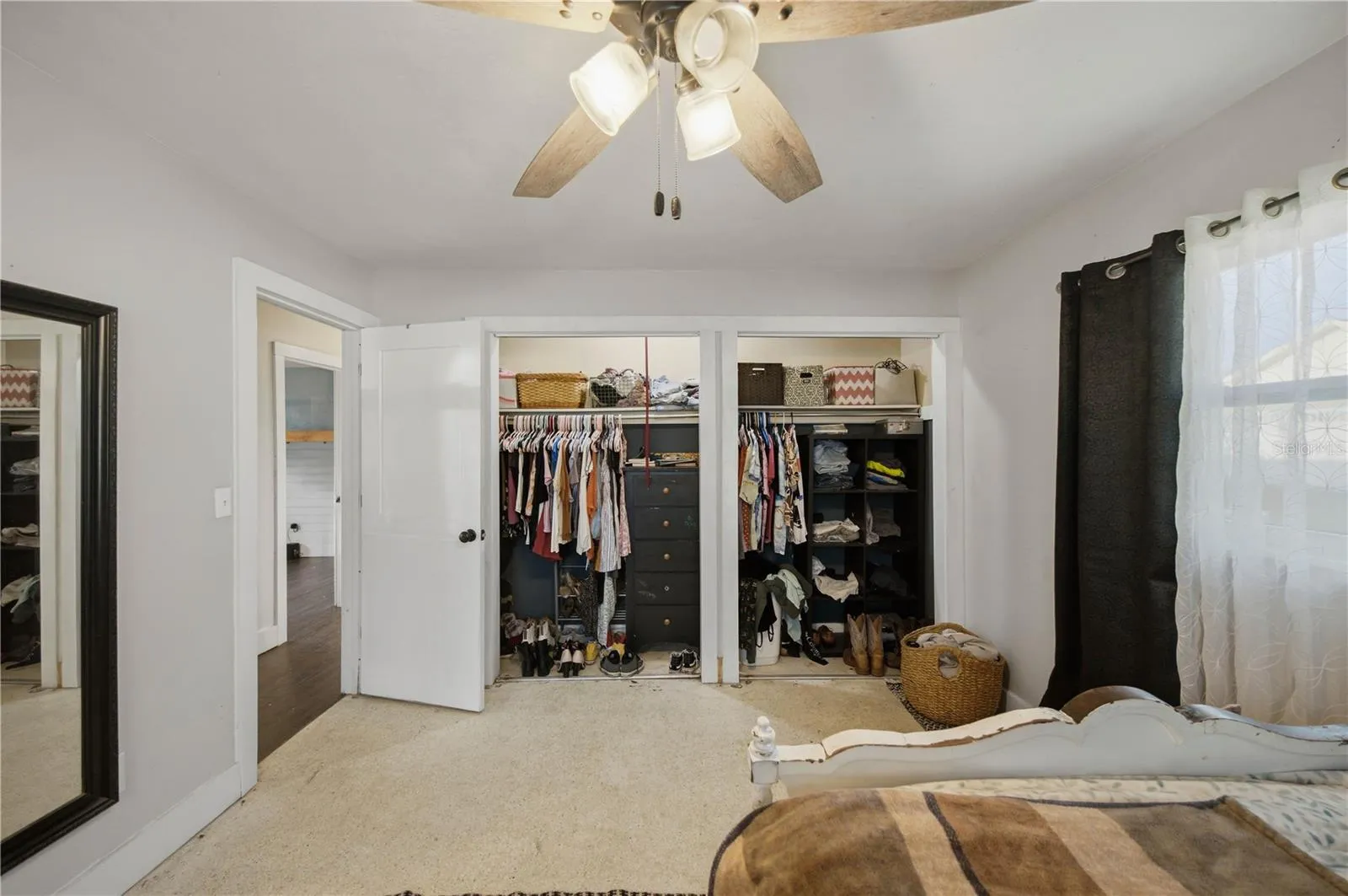 Primary bedroom with Terrazzo flooring and two XL closets
