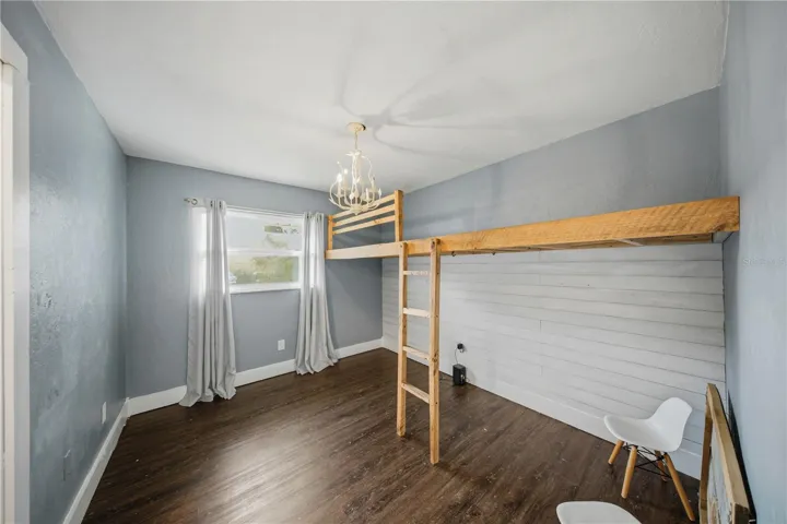 Third bedroom with loft bed (light fixture does not convey and will be replaced with original)