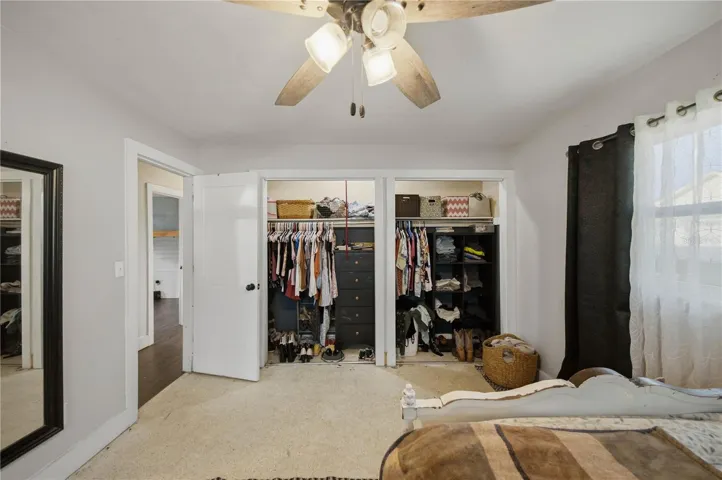 Primary bedroom with Terrazzo flooring and two XL closets