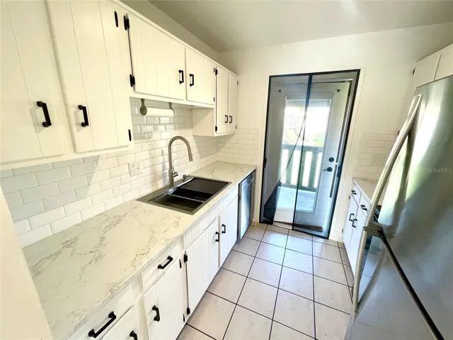 Kitchen view to back patio door