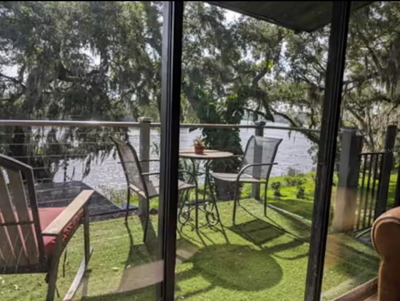 Balcony with stairs down to pool and river
