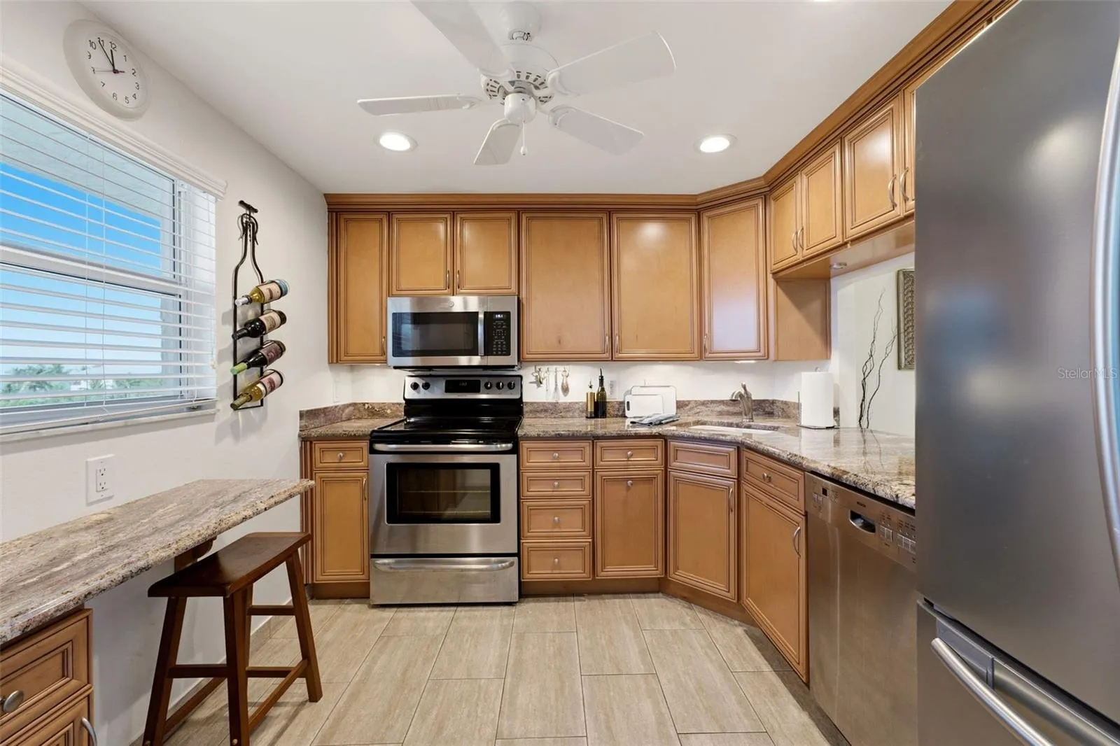 Well-appointed kitchen with solid-wood cabinetry and granite countertops.