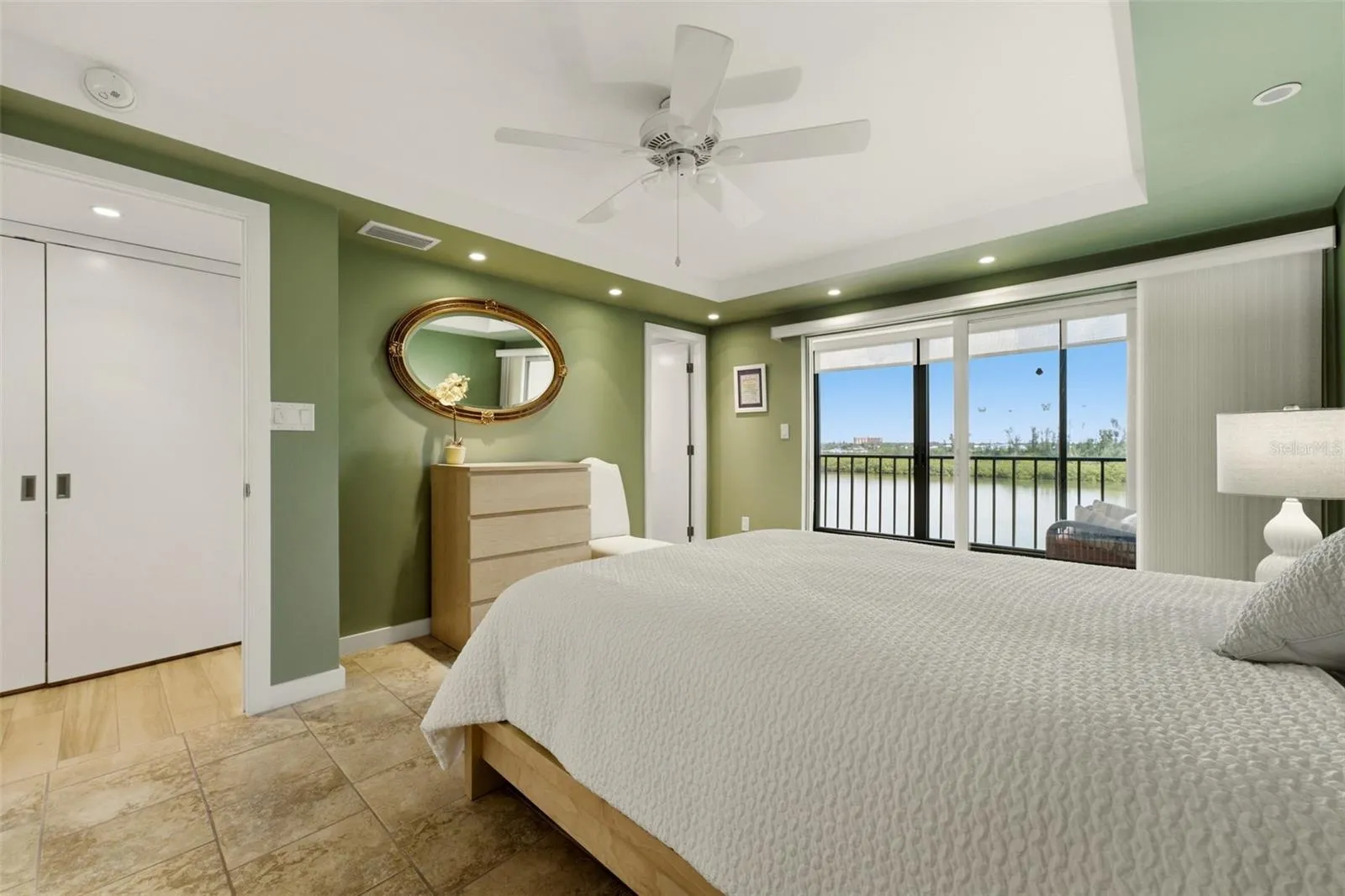 Relaxing primary retreat with generous closet space.