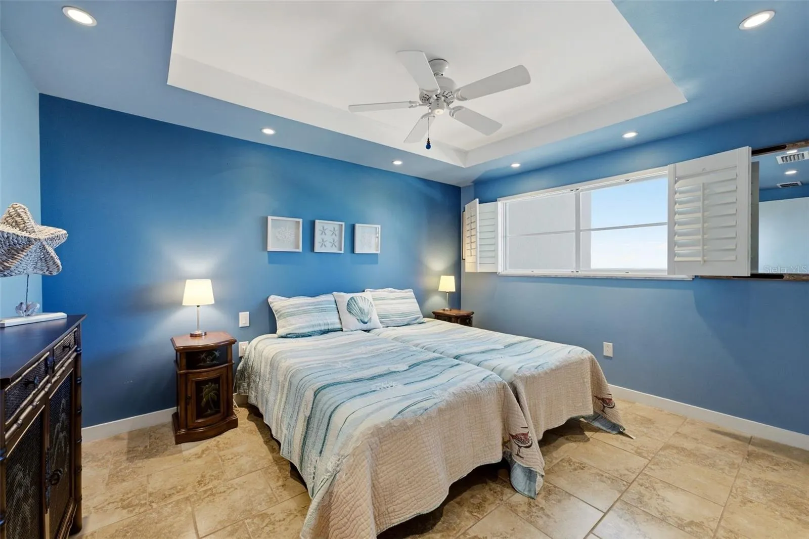 Serene guest bedroom with coastal-inspired blue tones.