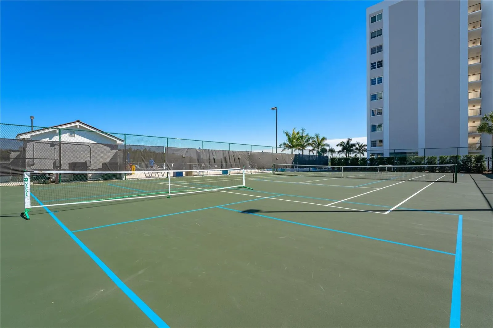 Lighted tennis and pickleball courts for year-round recreation.
