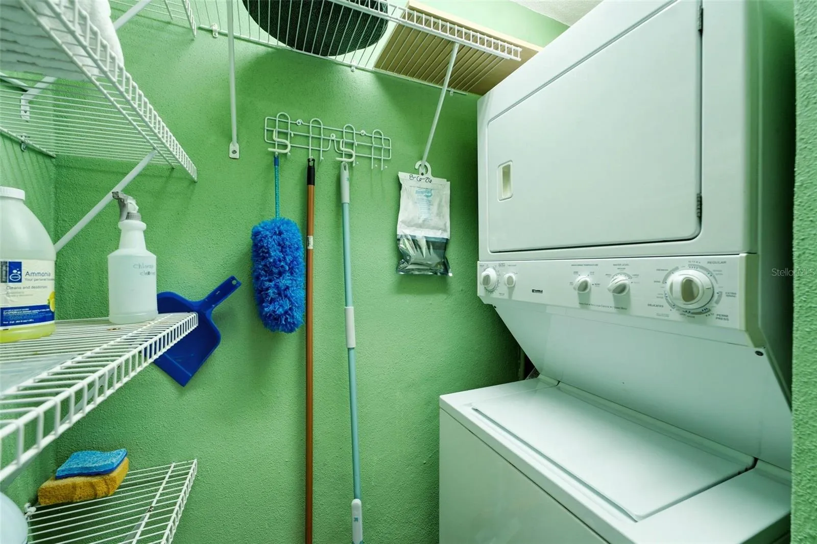 Private utility room with convenient washer and dryer and separate water heater.