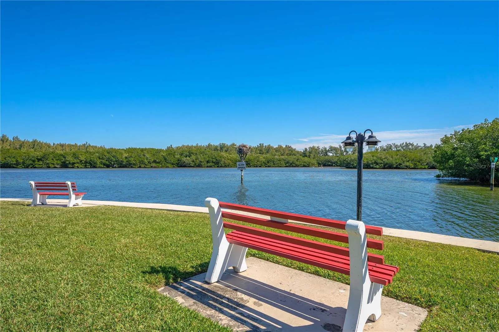 Waterfront seating along the scenic community shoreline.