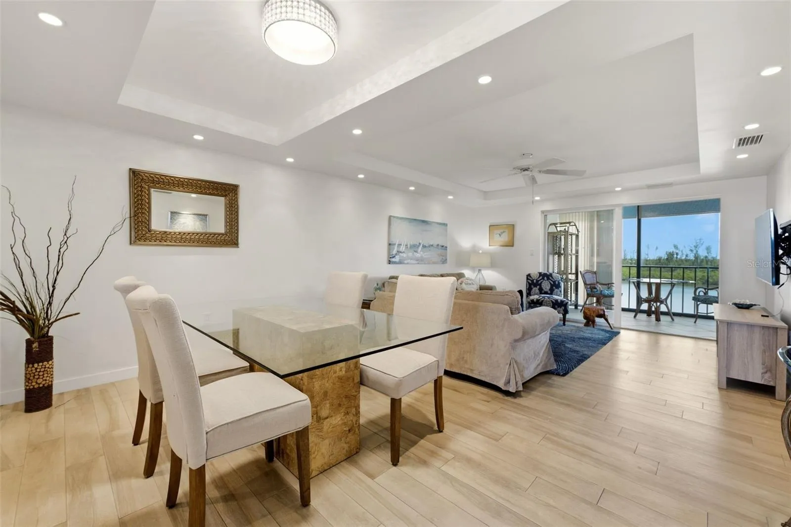Light-filled living and dining area extending naturally to the lanai.