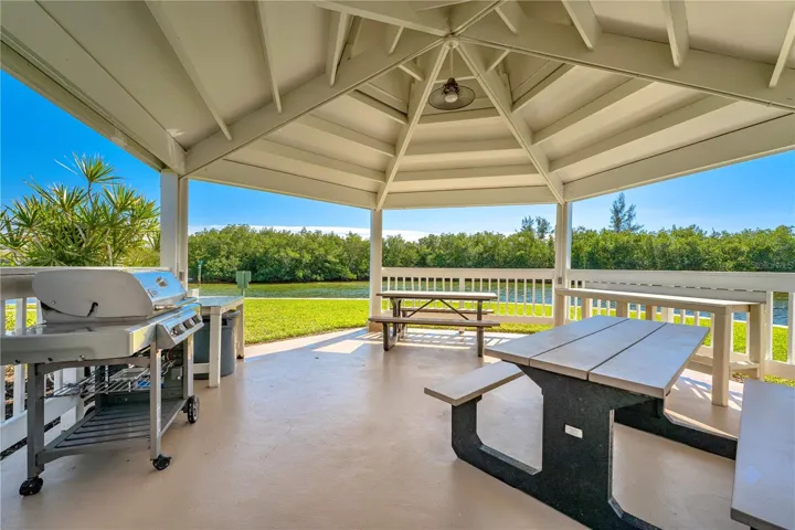 Private island gazebo with grill, BBQ, and reservable access.