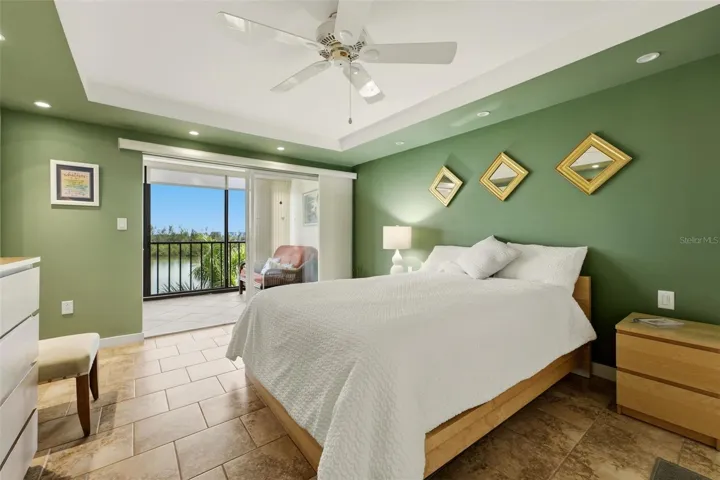 Tranquil primary bedroom with soothing green tones.