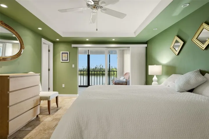 Spacious primary bedroom with coastal views and natural light