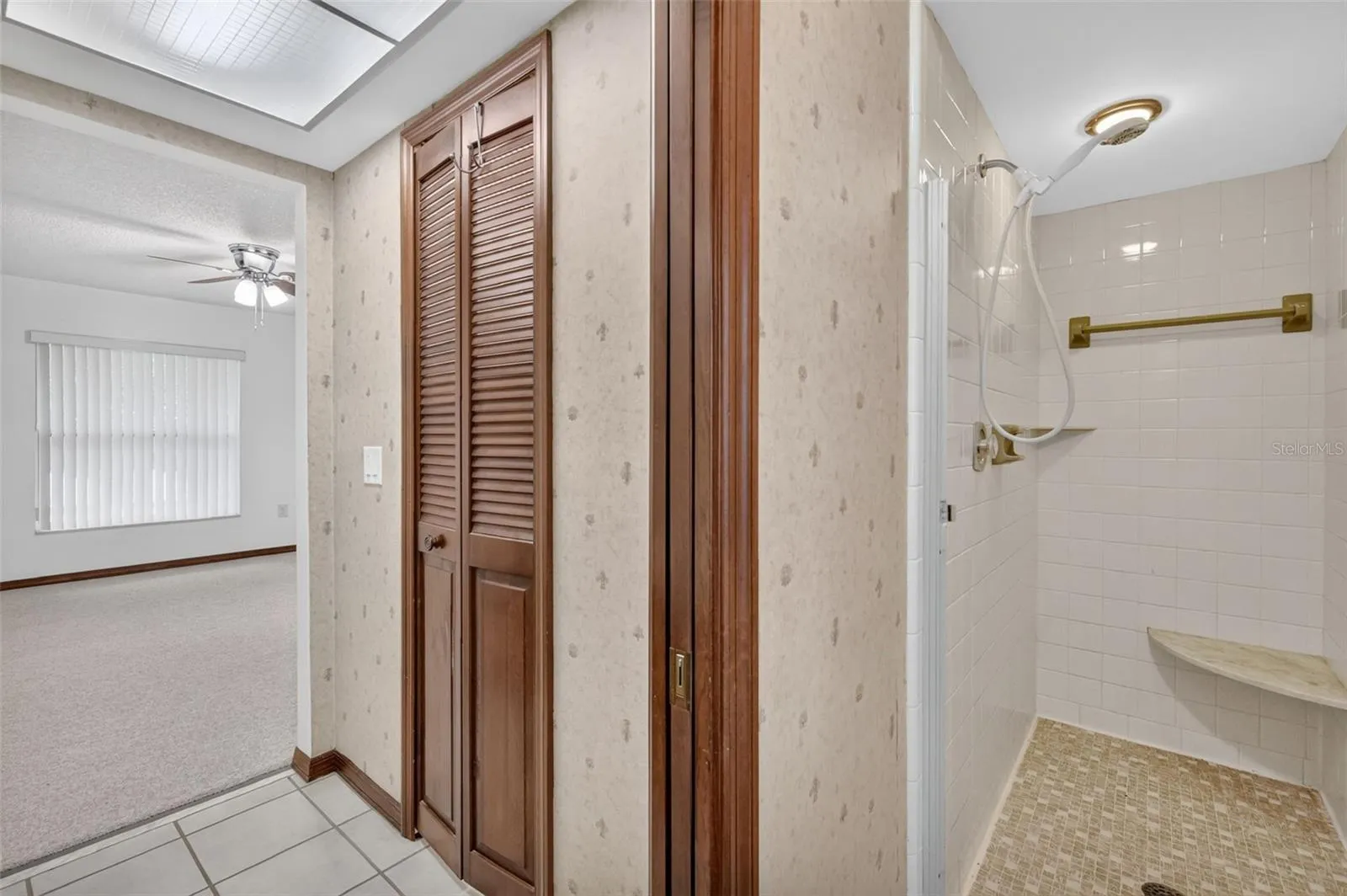 Primary Bathroom with walk in closet and shower