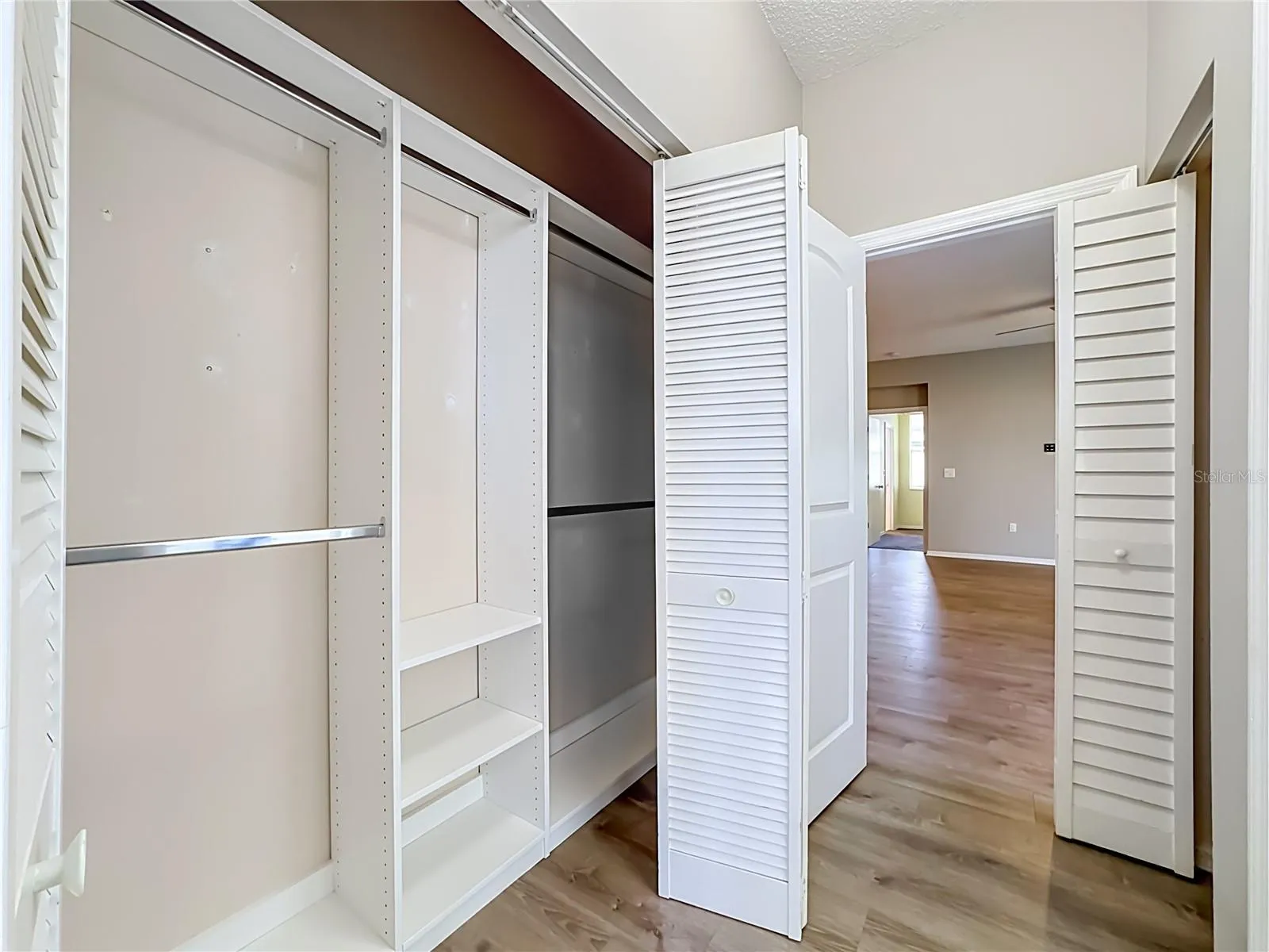Guest bedroom closet with custom shelving.