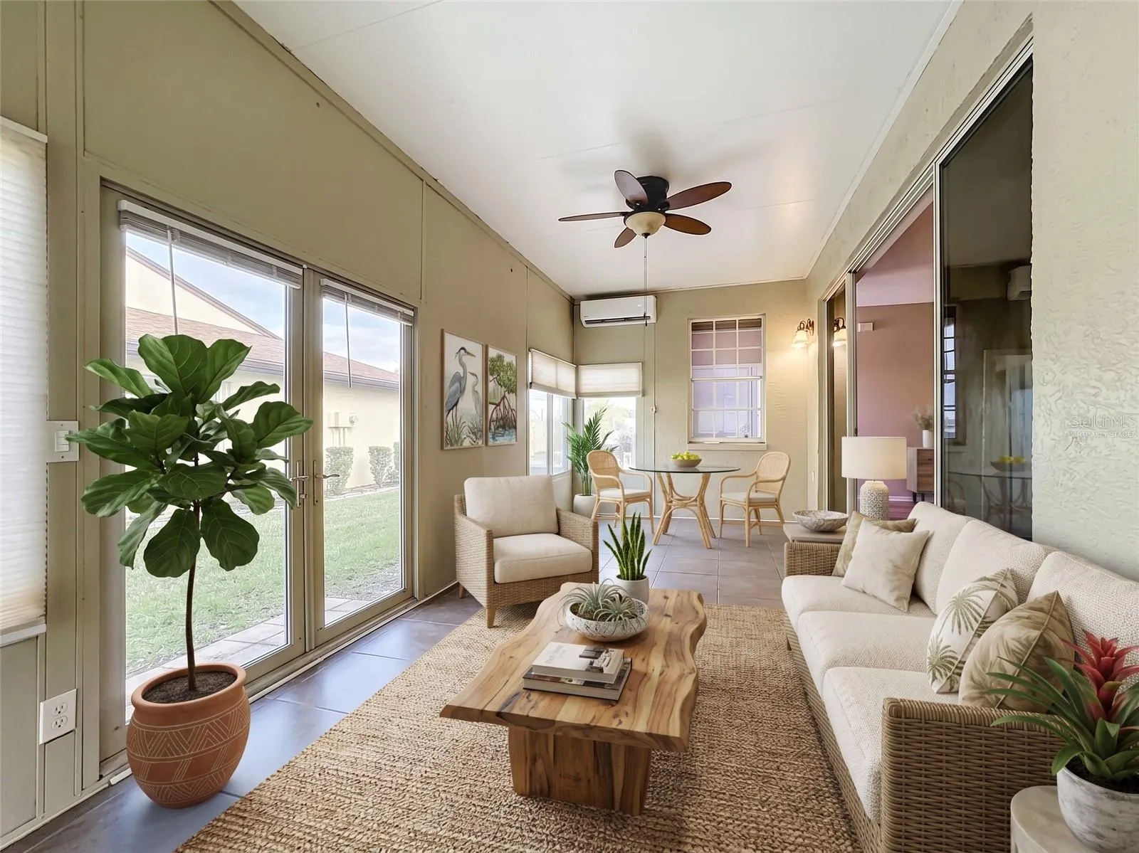 Virtually Staged -- Air Conditioned Florida Room with Mini Split AC (2025), adding 280 sq. ft. of comfortable living space.