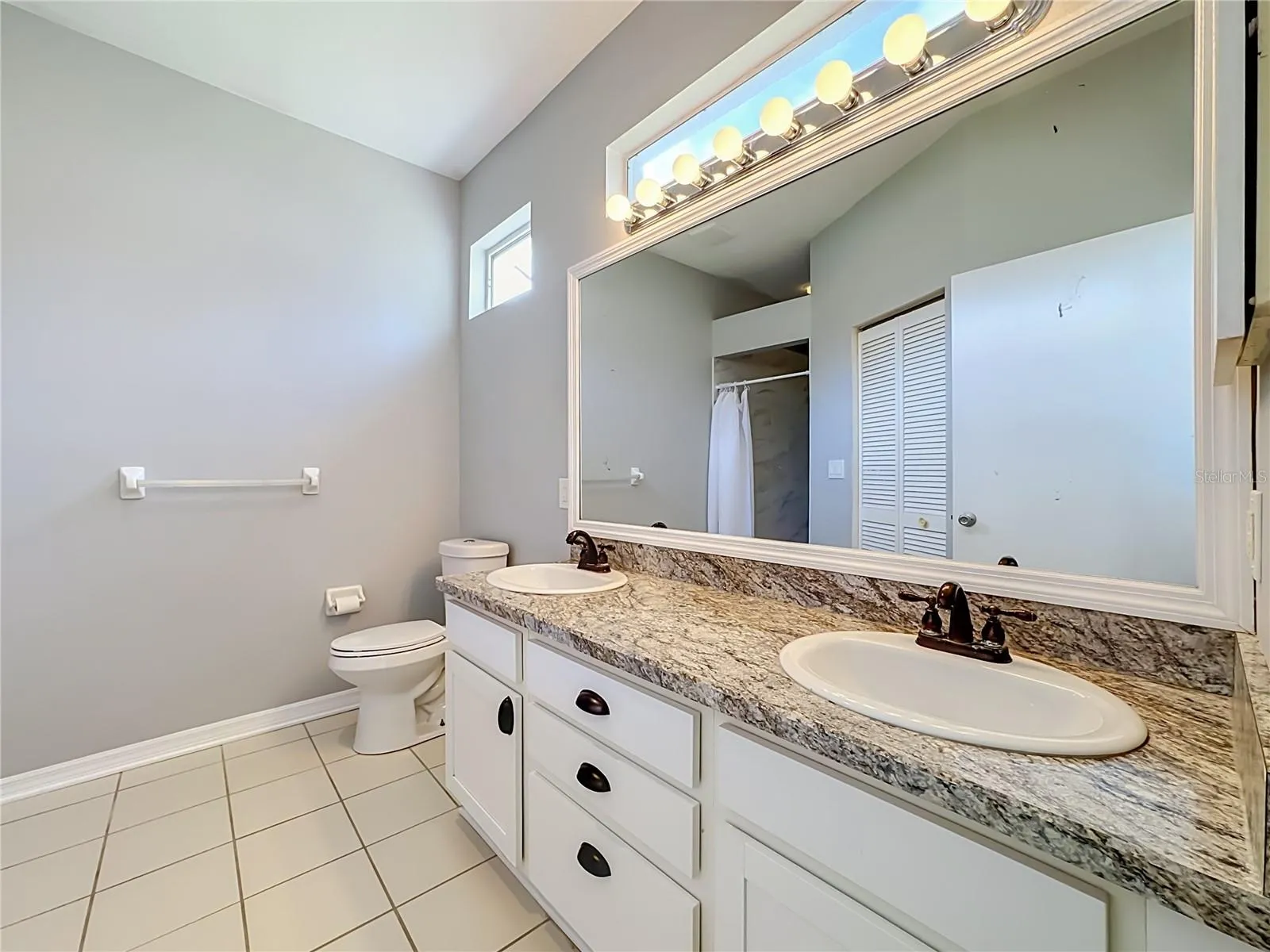 Primary bathroom with dual sinks and BRAND NEW walk-in shower.