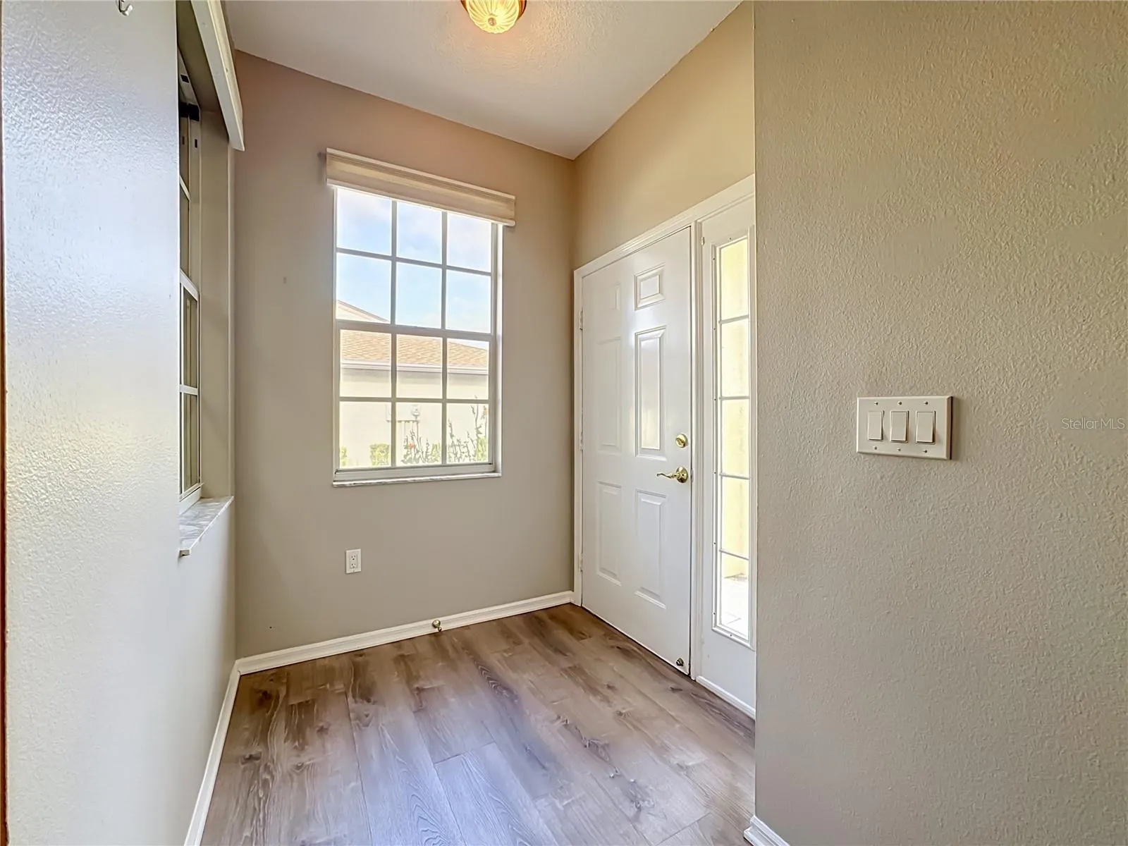 Entrance and foyer with luxury vinyl plank flooring.