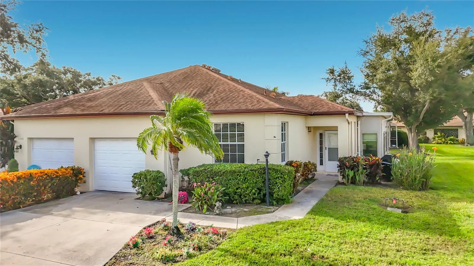 Single car garage with two additional parking spaces in driveway.