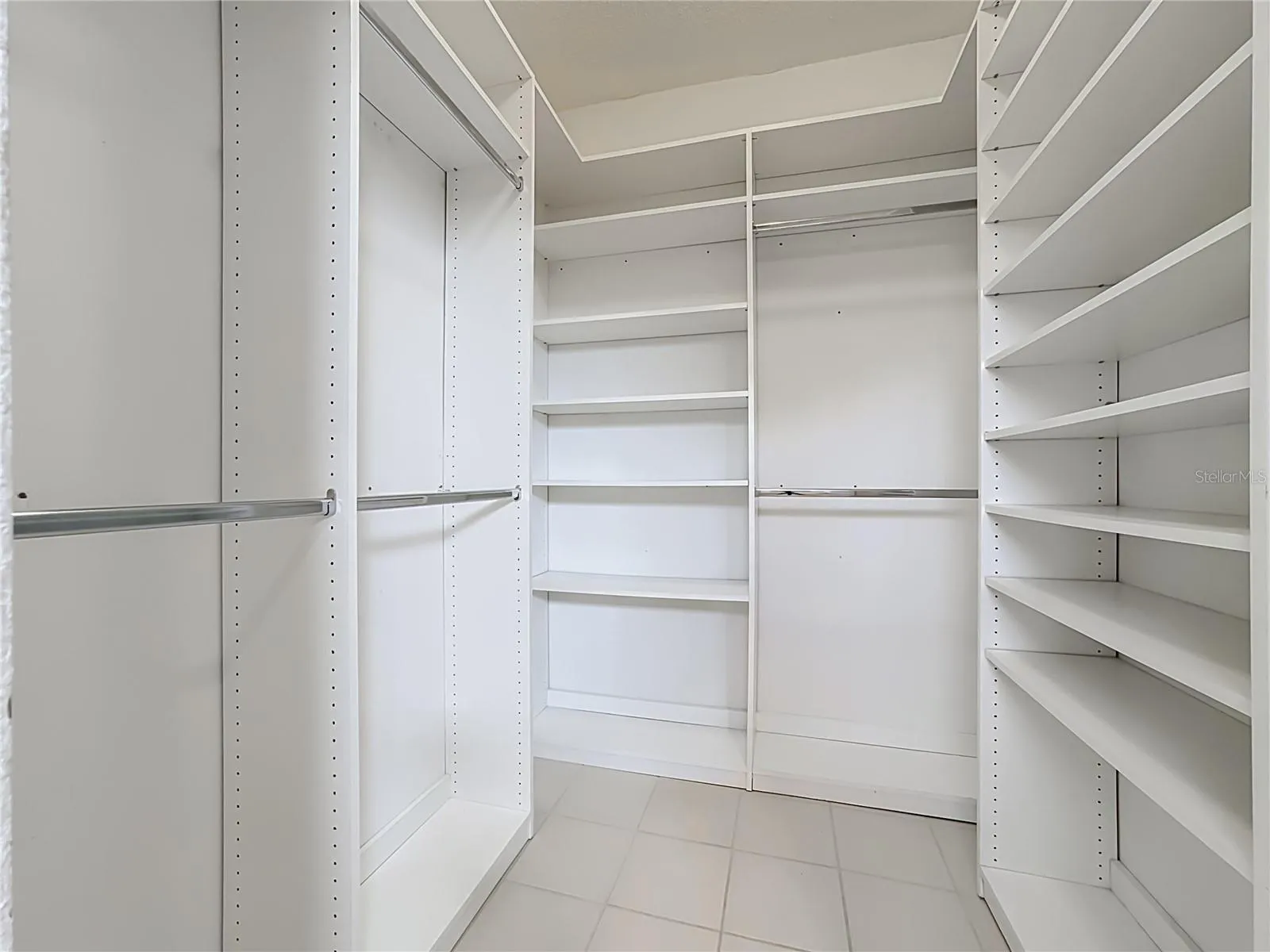 Primary bedroom custom built closet.