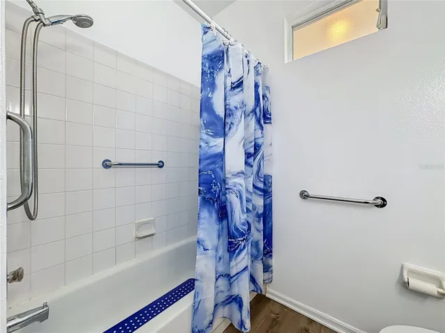 Guest tub and shower combination with the comfort or a grab bar.