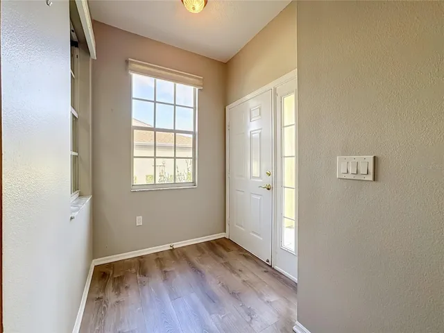 Entrance and foyer with luxury vinyl plank flooring.
