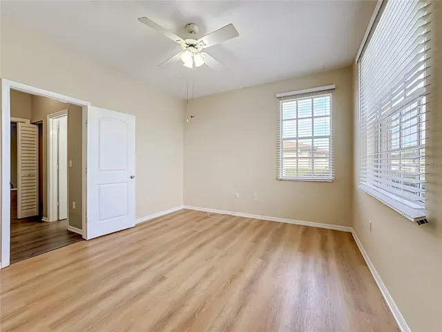 Luxury vinyl plank flooring in guest bedroom.