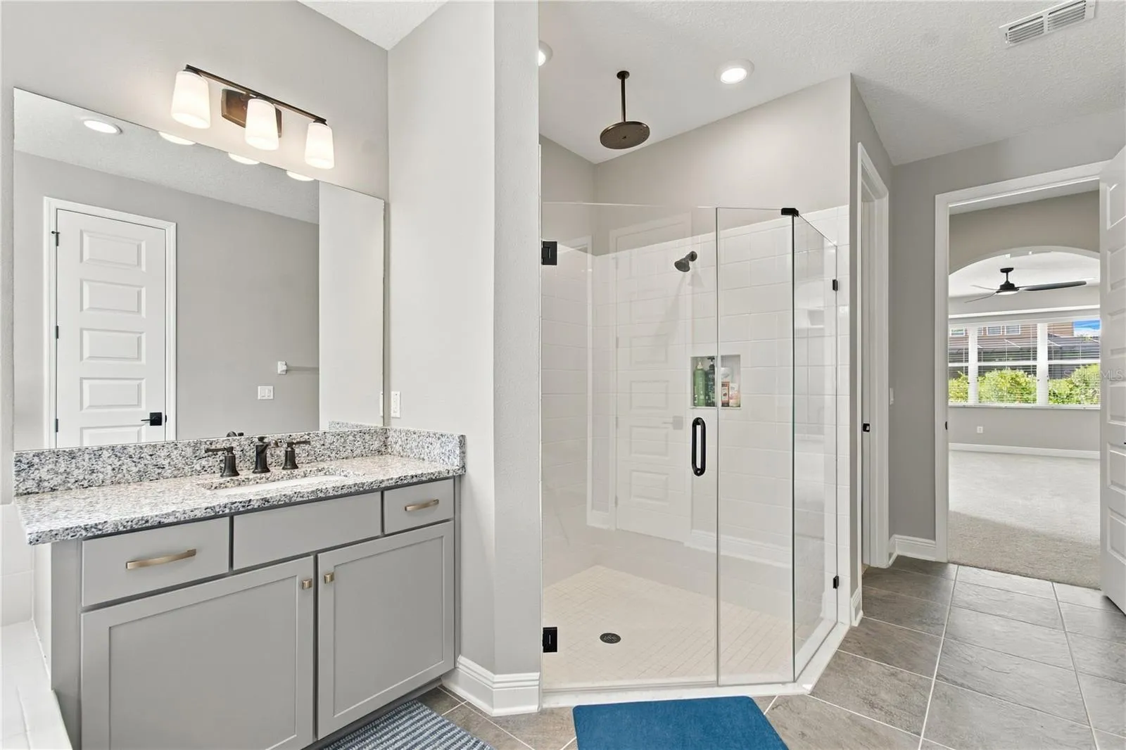 Master Bath with Rain shower head and separate Vanity