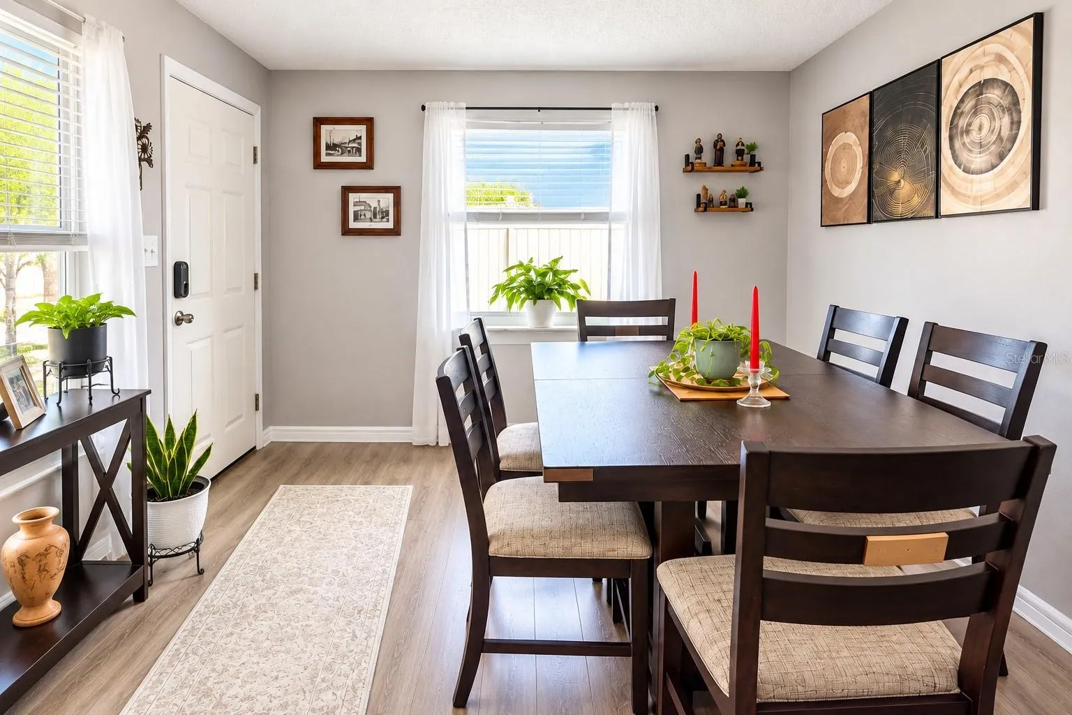 Spacious dining area or second living room featuring luxury vinyl plank flooring and smooth ceilings.