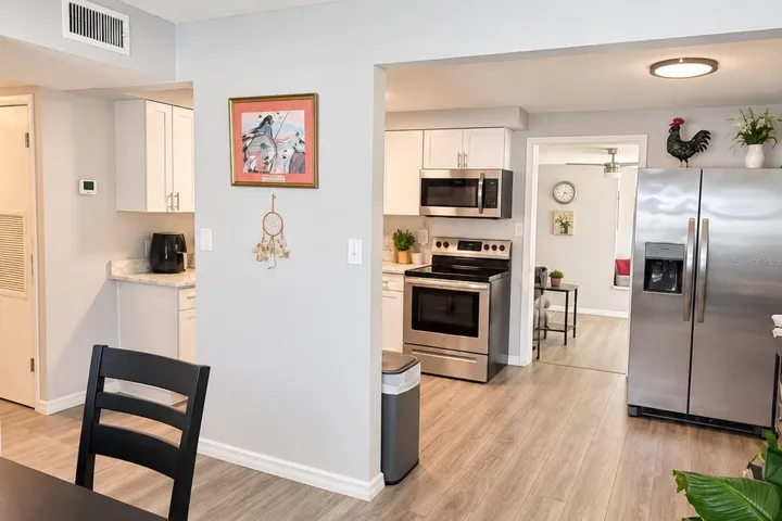 Stainless-steel appliances and generous workspace complete the updated kitchen.