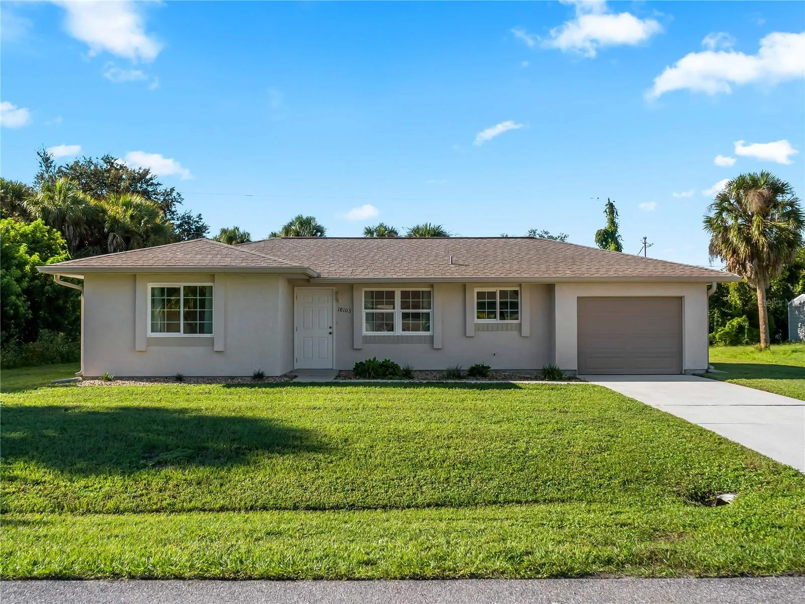 FrontExterior_18103WindsweptAvenue_PortCharlotte_CurbAppeal_Daylight.jpg