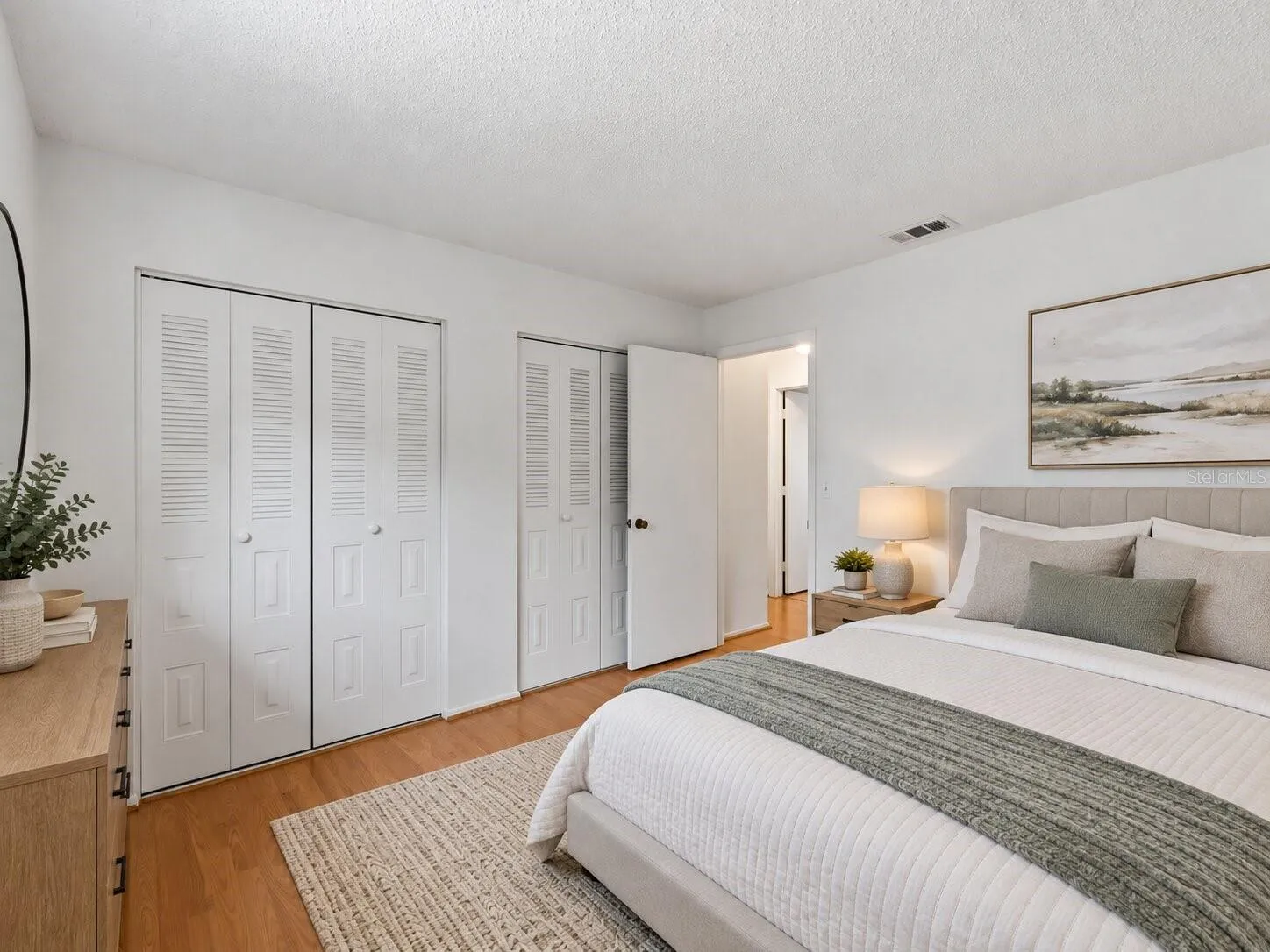 Virtually_Staged_Bedroom_18103WindsweptAvenue_PortCharlotte_Closet_Corner.jpg